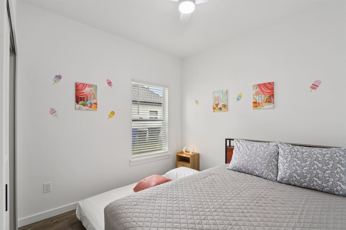 Bedroom has Queen Bed, twin trundle under bed, nightstand, suitcase holder, closet with hangers