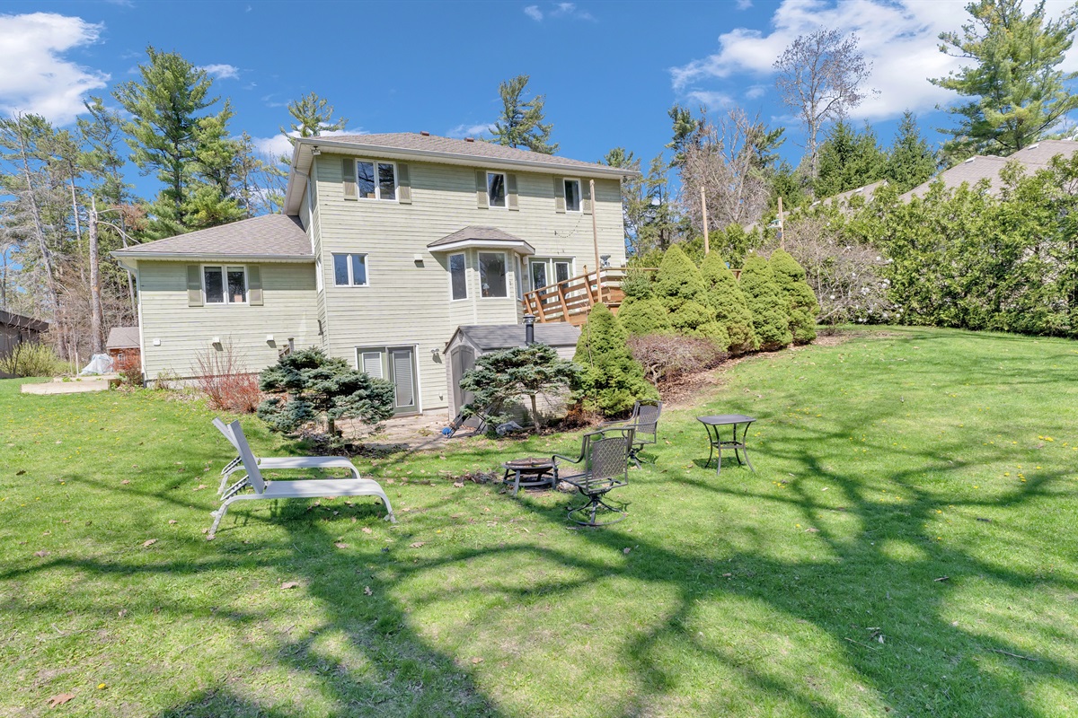     &ldquo;Spacious backyard surrounded by mature trees&rdquo;