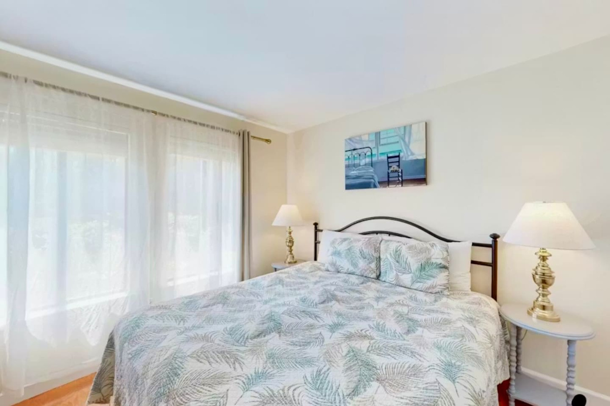 Queen bedroom with bright window