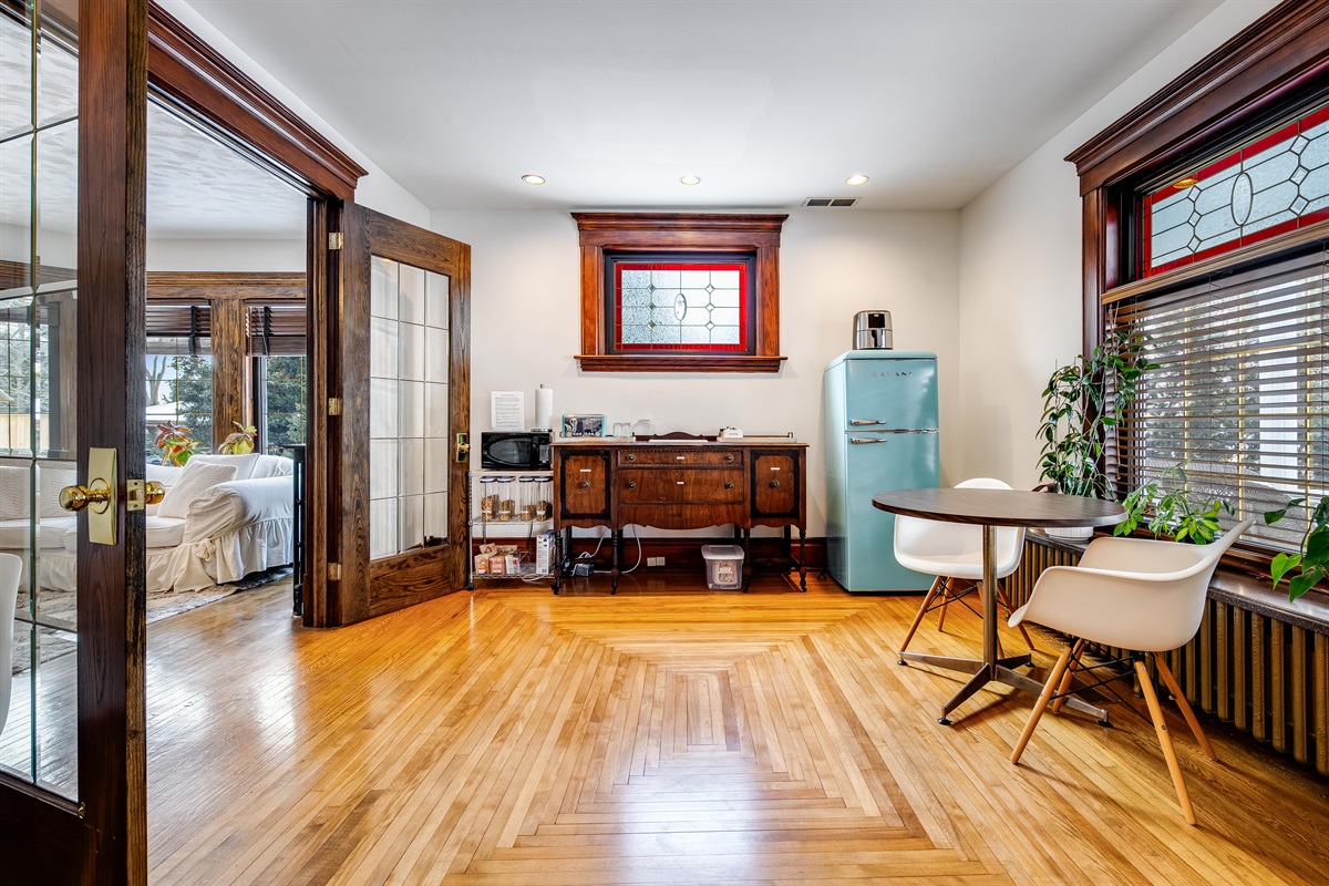 Shared breakfast area with toaster, microwave, and fridge.