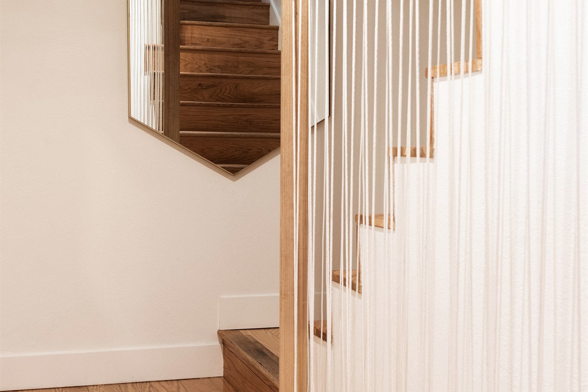 Modern staircase with clean design and open feel—connecting levels of your Lake Arrowhead cabin with style and ease.