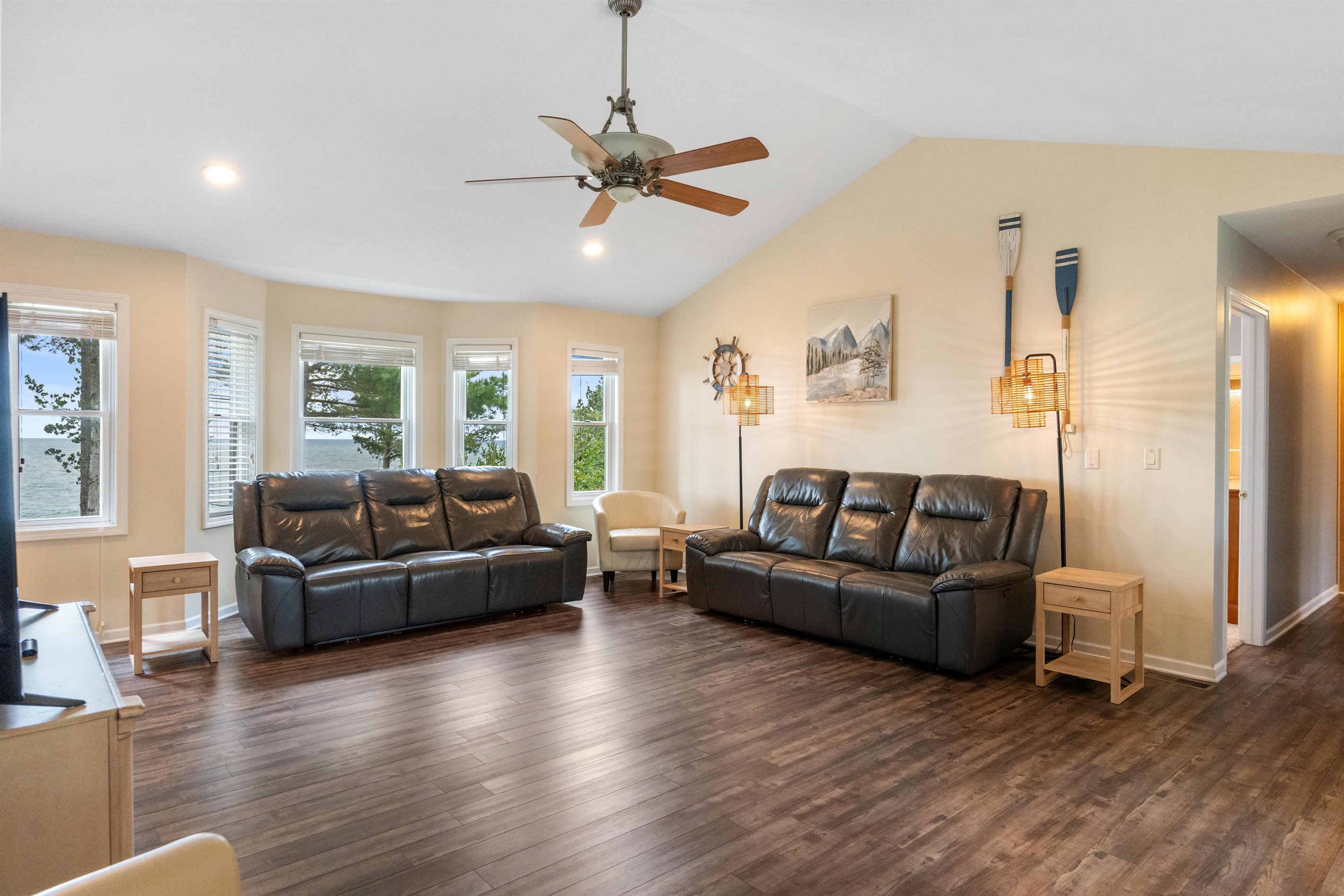 Huge, vaulted ceiling Living Room with 2 full sized leather sofa recliners and sitting chairs