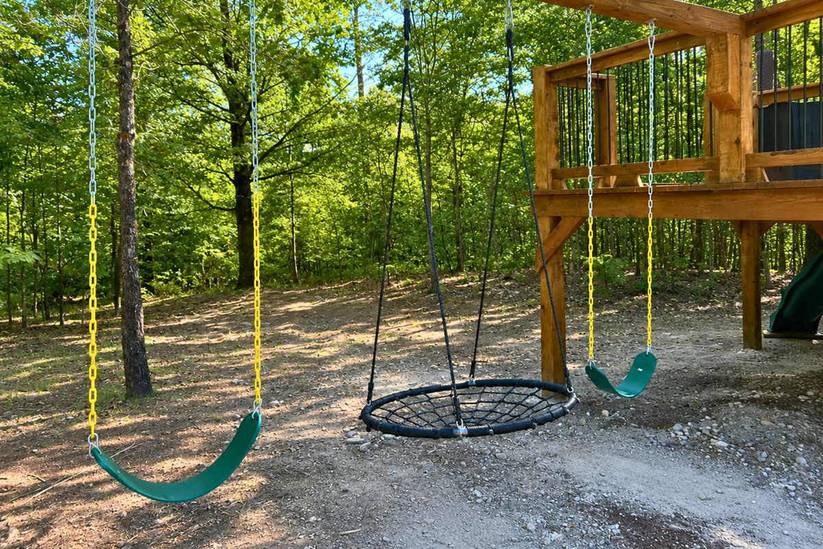 Kids can spend plenty of time outdoors with swings tucked beneath the trees, giving them their own fun space to play while enjoying the fresh air.