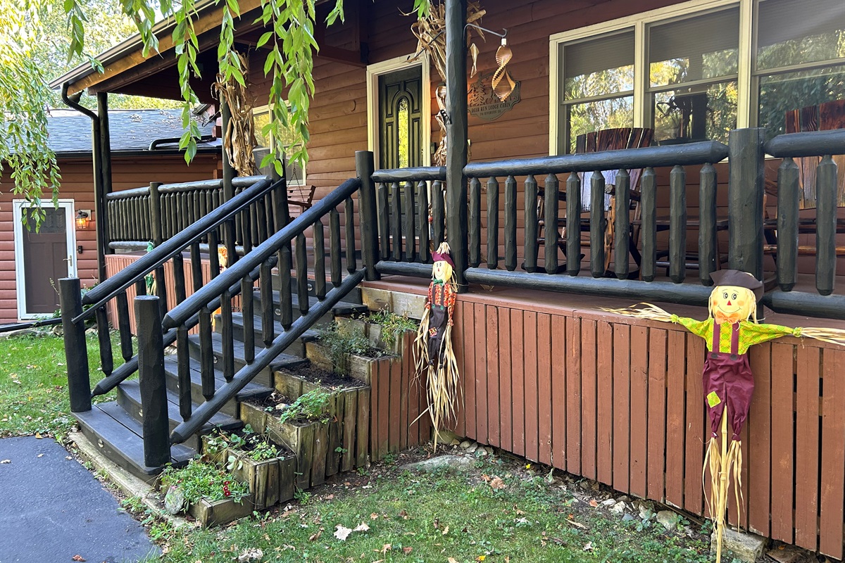 Stairs leading to cabin front porch. The stairs are lit at night.