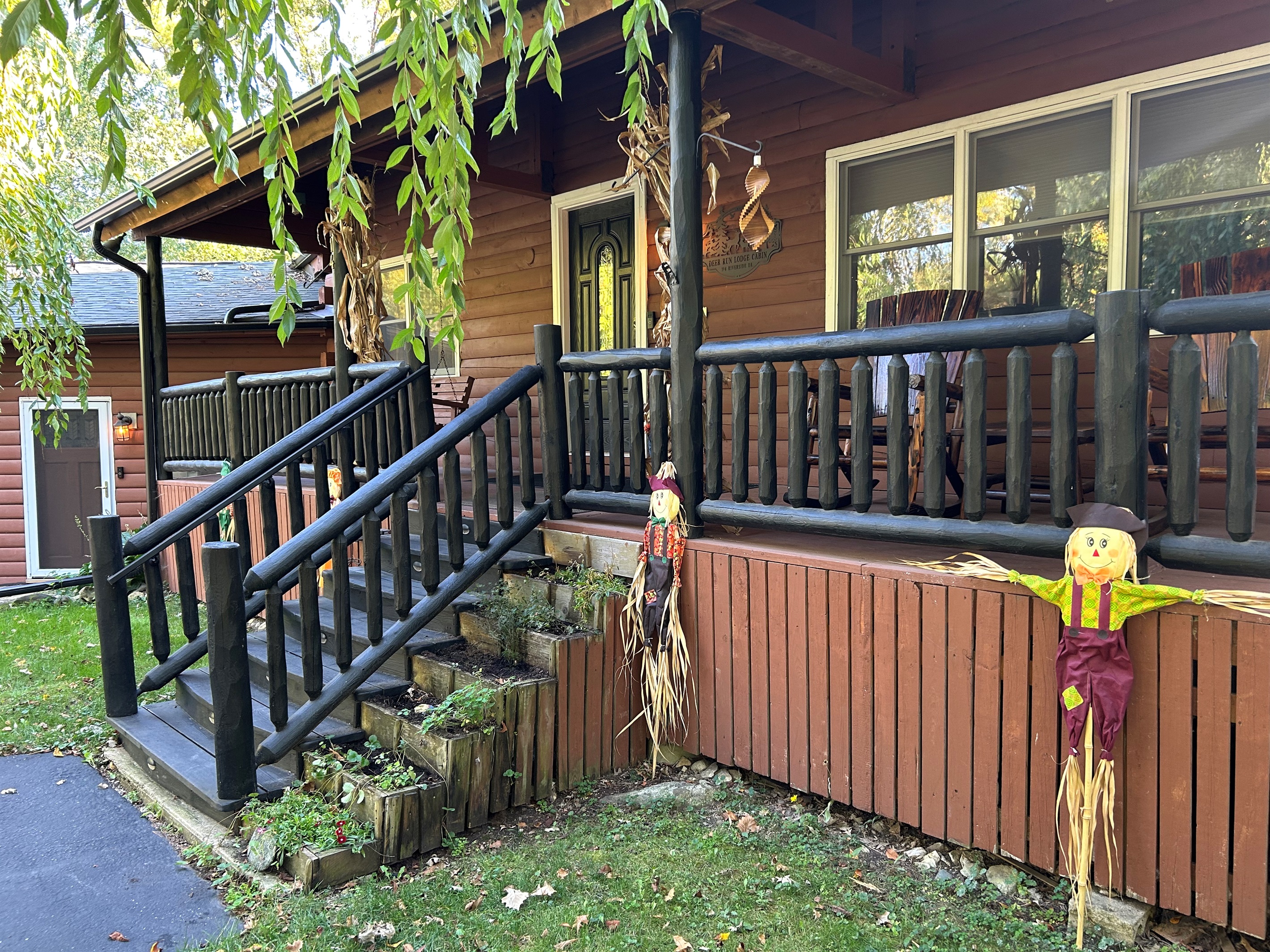 Stairs leading to cabin front porch. The stairs are lit at night.