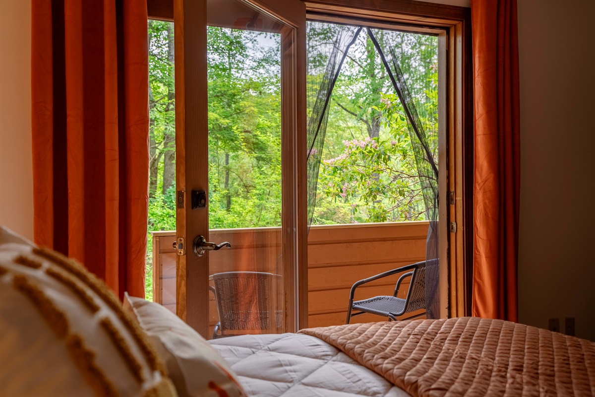 Wake up to a forest view right from your cozy bedroom balcony.