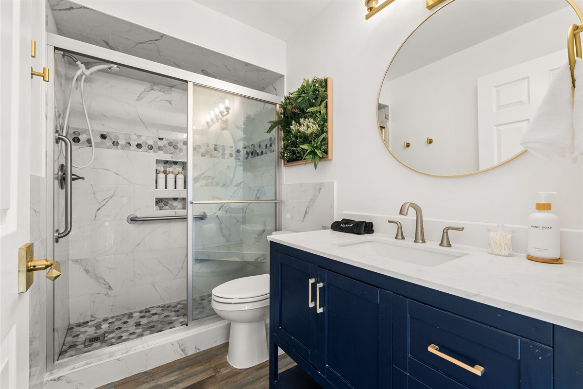 The master suite has it's own en-suite with large walk in shower and oversized mirror