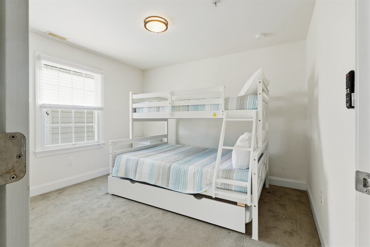 Twin-over-full pyramid bunk with trundle—perfect for groups