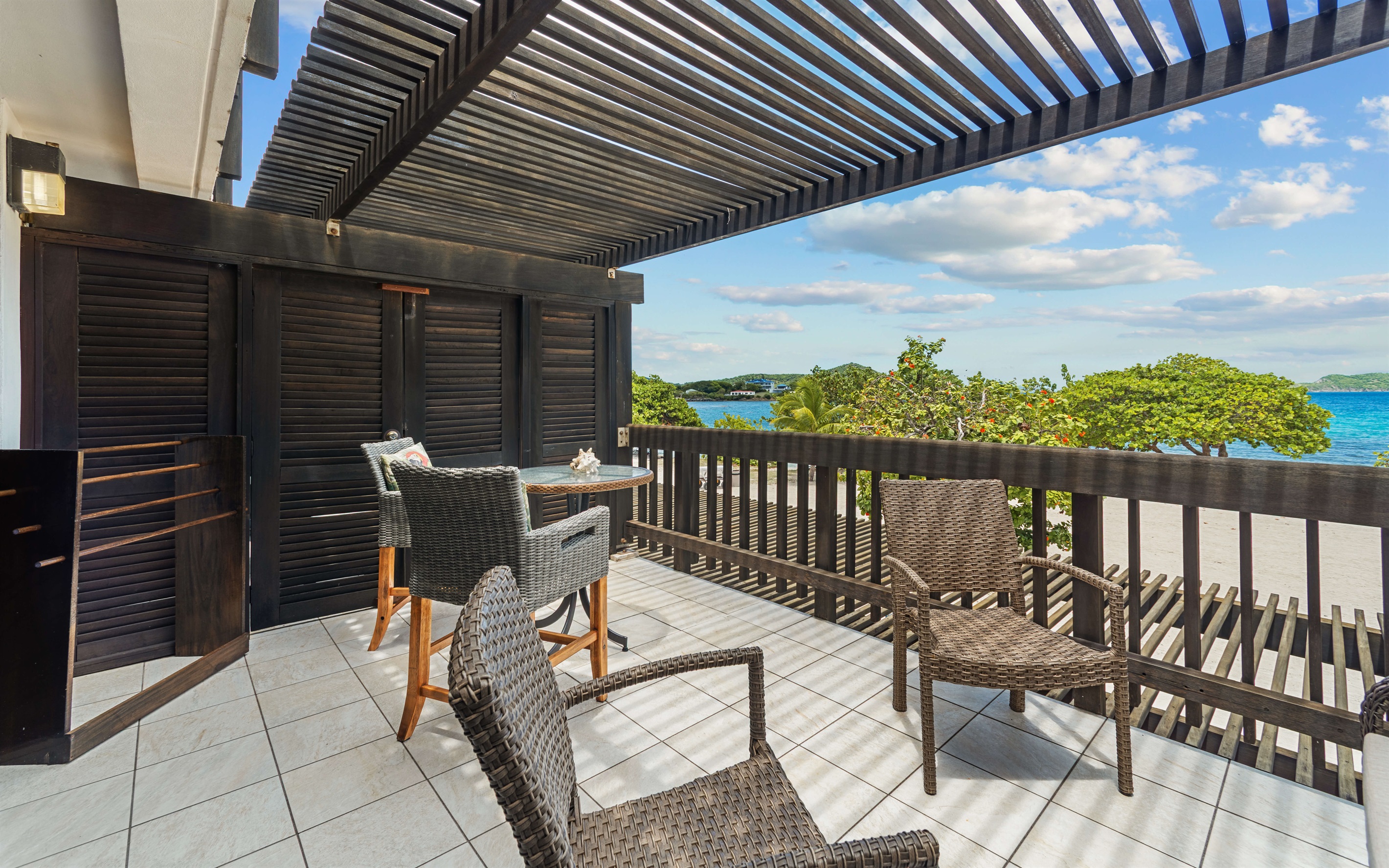 watch the boats and sunbathers from your private terrace