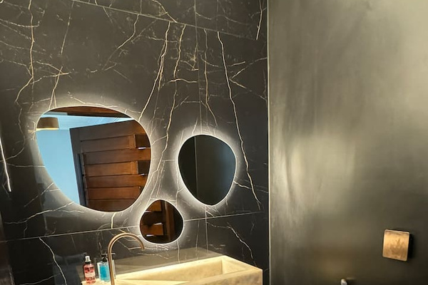 Powder room that we designed with translucent onyx stone!