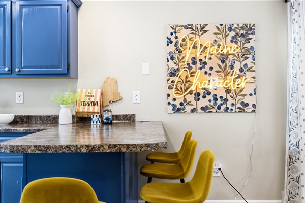 A stylish kitchen island with seating, perfect for casual dining, morning coffee, and gathering while meals are being prepared.