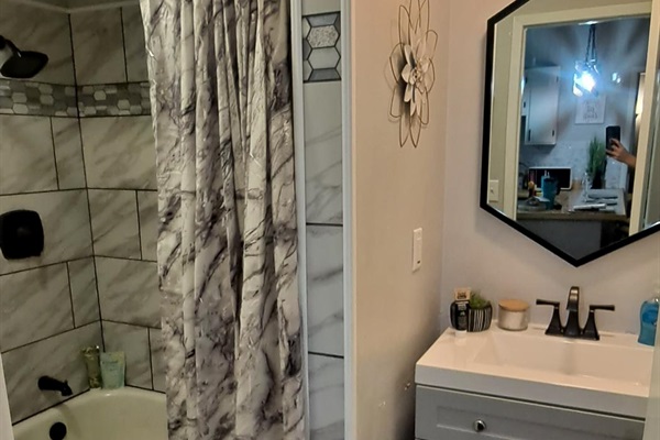 Spa-like bathroom with deluxe amenities and tub