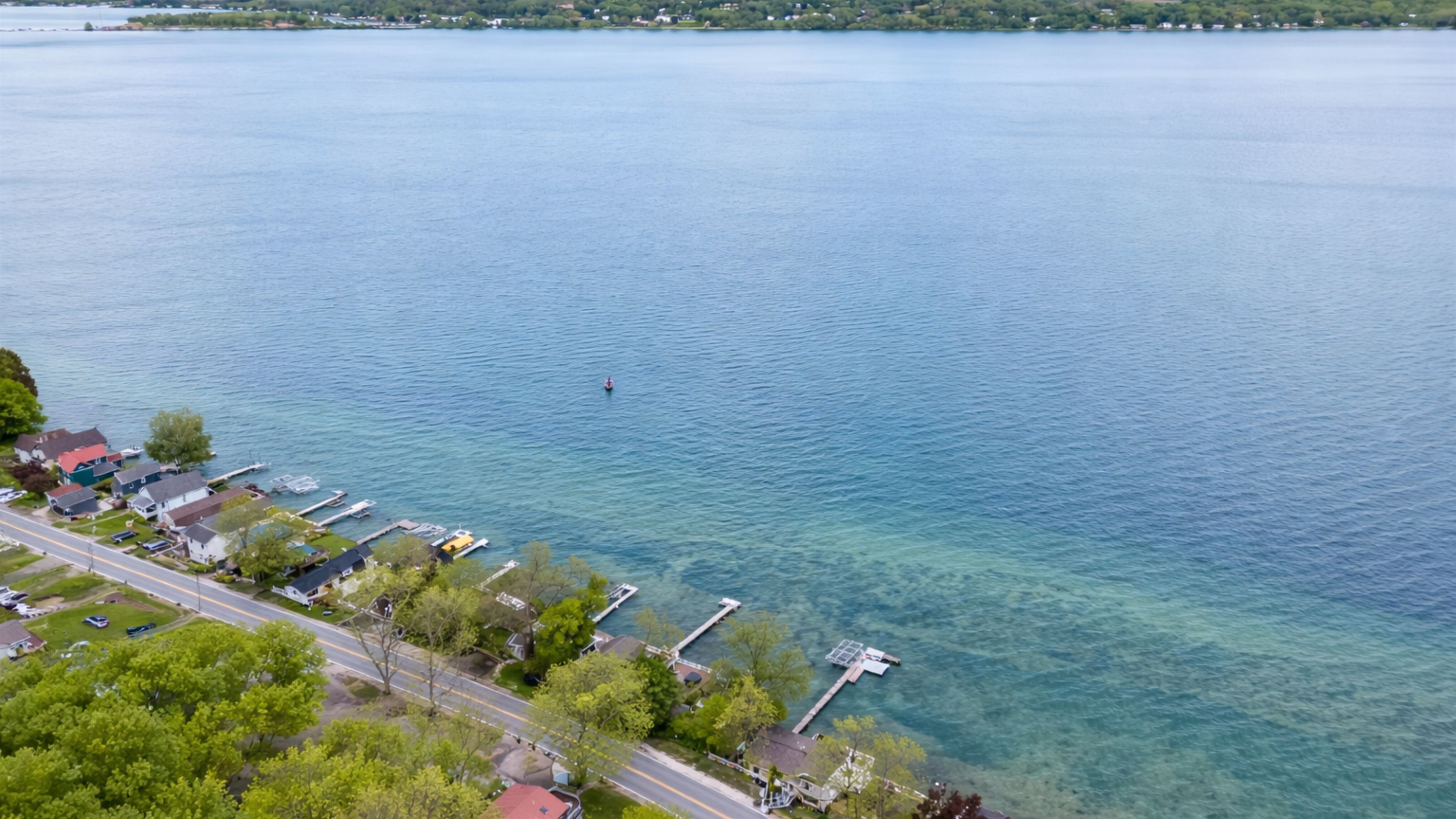 Nestled along a scenic shoreline, this cozy lakefront retreat sits in a charming and peaceful neighborhood 🌳🏘️✨