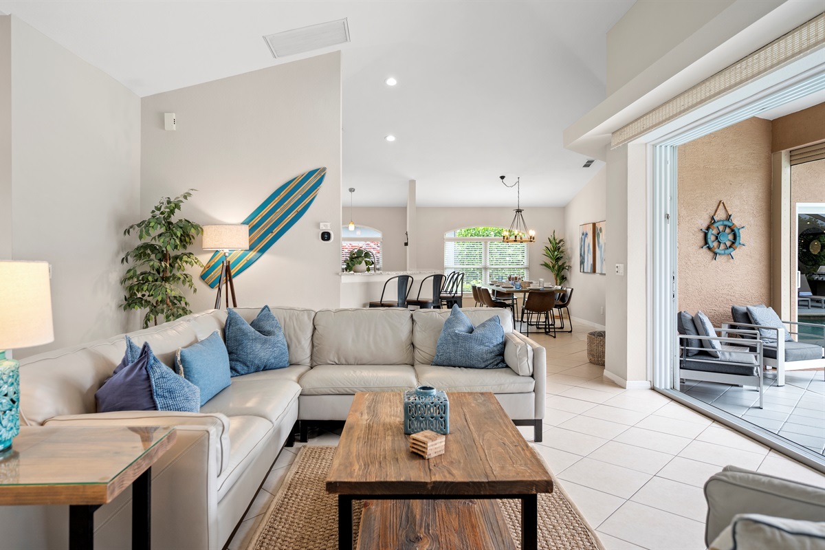 Coastal cool meets casual elegance—this open-concept living space brings the beach indoors