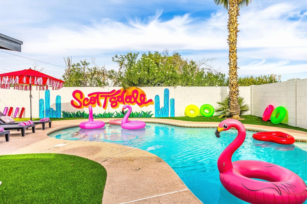 Dive into a fun-filled day with colorful float rings and sun-soaked poolside lounging.

