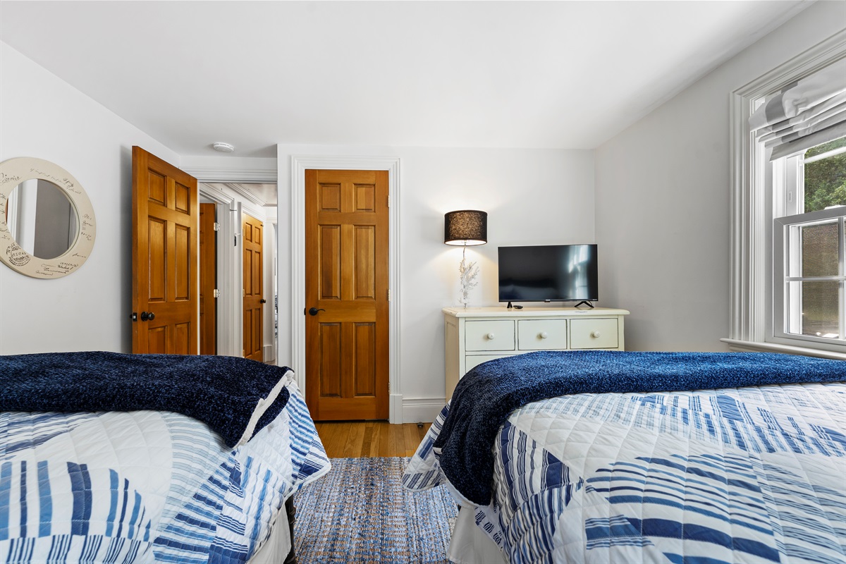A serene escape with two soft double beds, making sleep feel effortless.