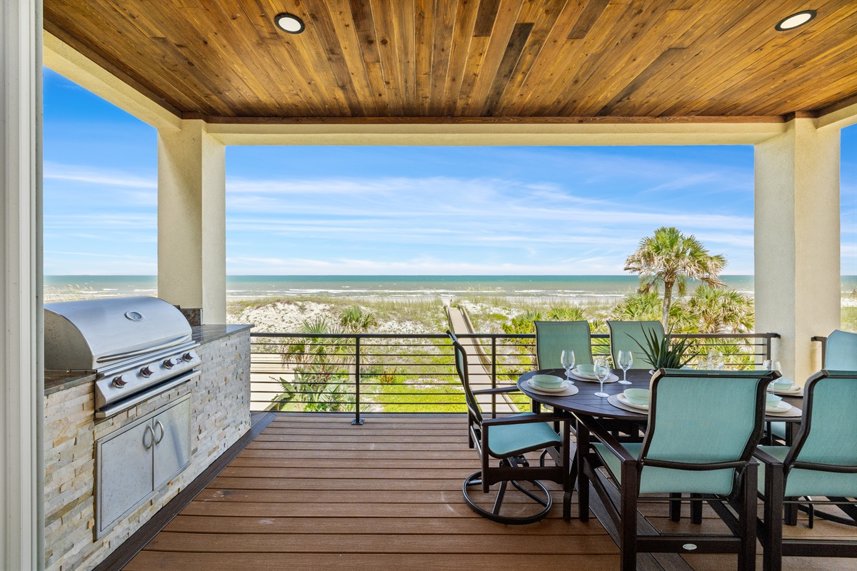 Covered outdoor balcony with grill and dining - stunning views included