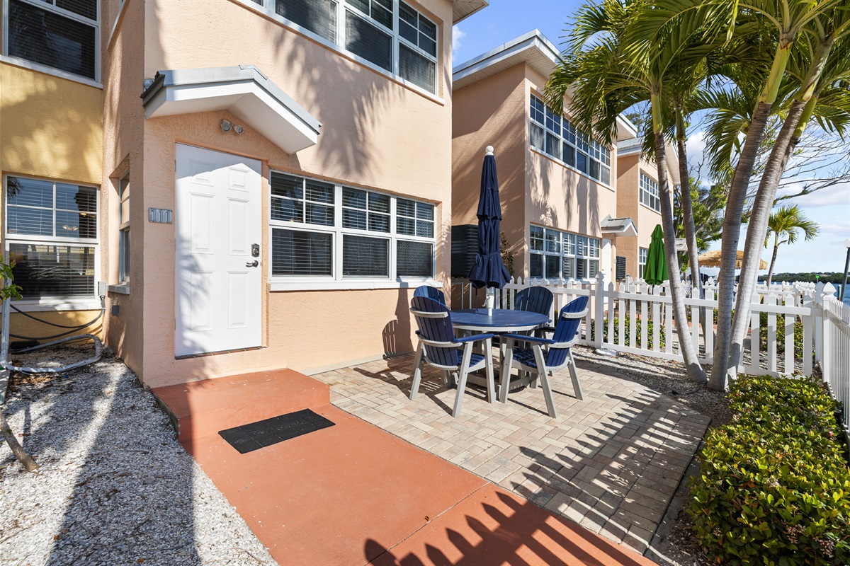 The private waterfront courtyard is accessed through the back door of the unit