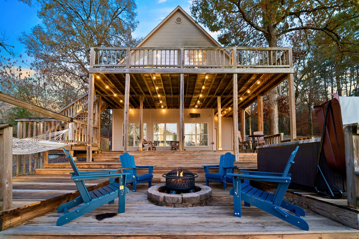 A full view of the outdoor living spaces shows the thoughtful design&mdash;from seating to decks to lighting&mdash;that makes relaxing outdoors so effortless.