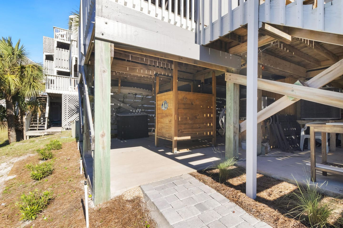 Your outdoor shower sits right at the two-car parking area &mdash; you will use it every single beach day.
