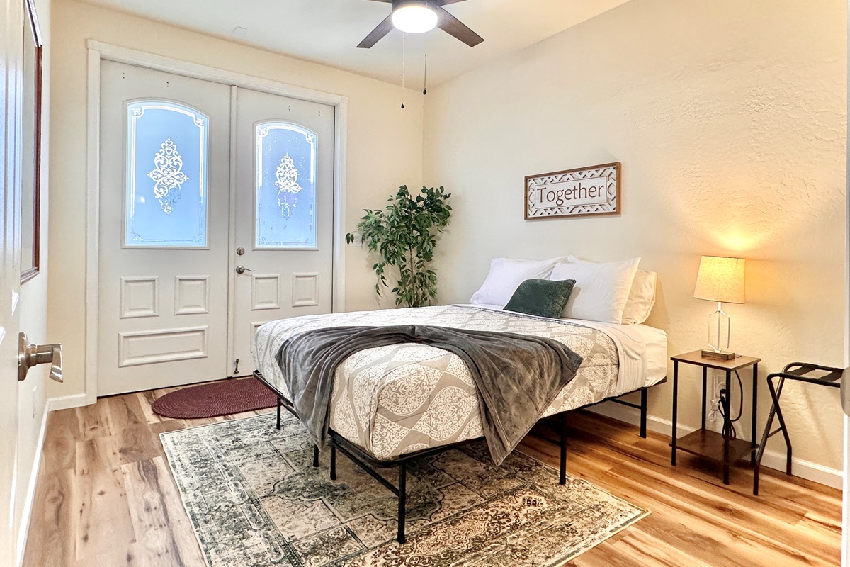 Bedroom #2: Queen bed with access to back entrance and closet for storage