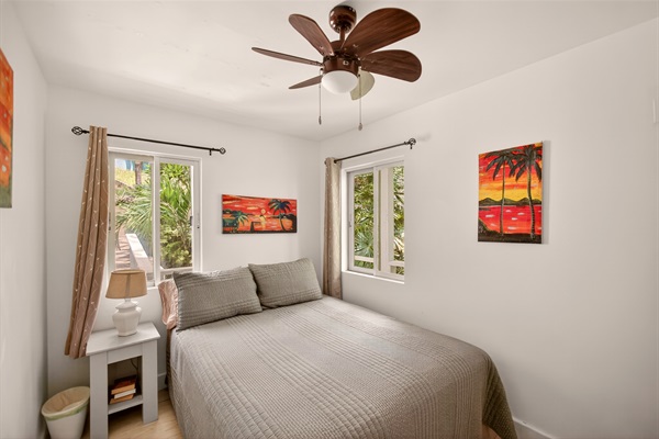 Main level bedroom with queen bed