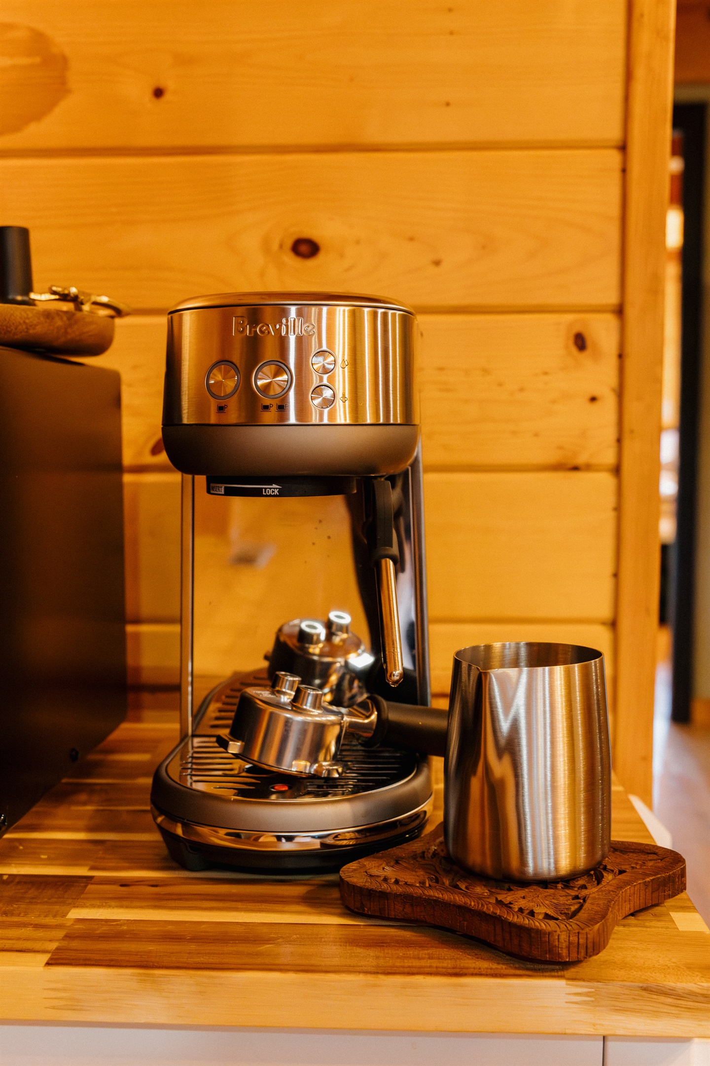 Wake up to barista-quality espresso with the Breville Bambino at Poppywood Pines. This luxury Show Low cabin features premium coffee equipment for caffeine lovers, perfect for fueling mountain mornings before exploring White Mountains hiking and fishing.