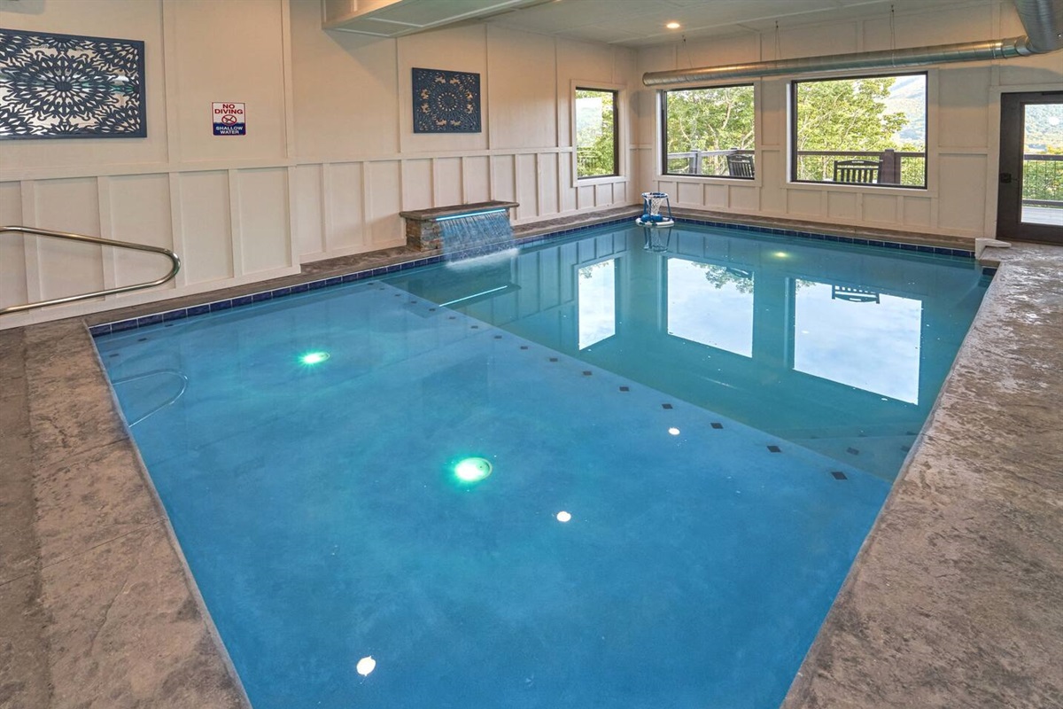 Indoor heated pool with calming waterfall and terrific views.