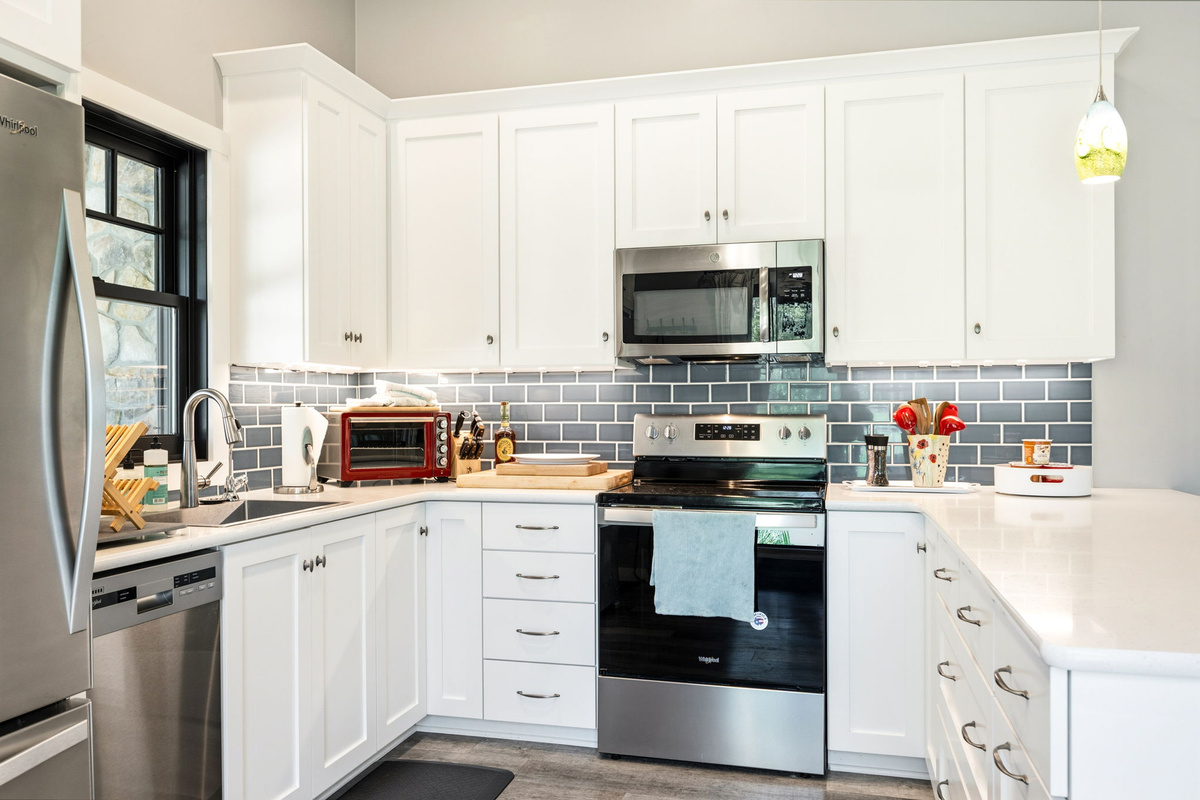 This chef-ready kitchen offers full-size stainless appliances, quartz counters, and everything you need to whip up a home-cooked meal.