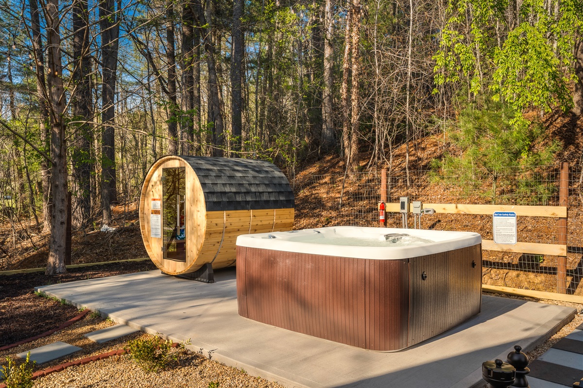 Hot tub and barrel sauna setup tucked into the trees - built for relaxation after a day exploring Asheville