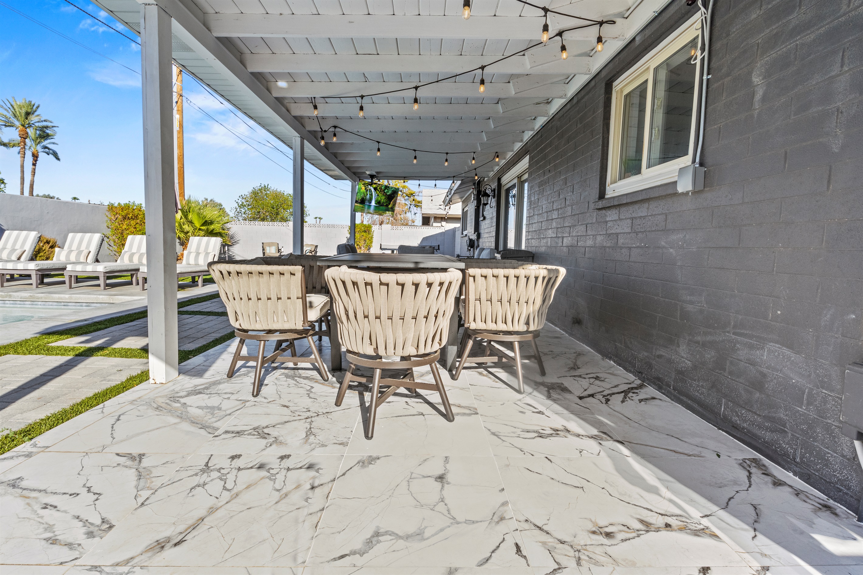 Gather with friends under the shaded patio, the perfect spot for morning coffee or sunset cocktails.