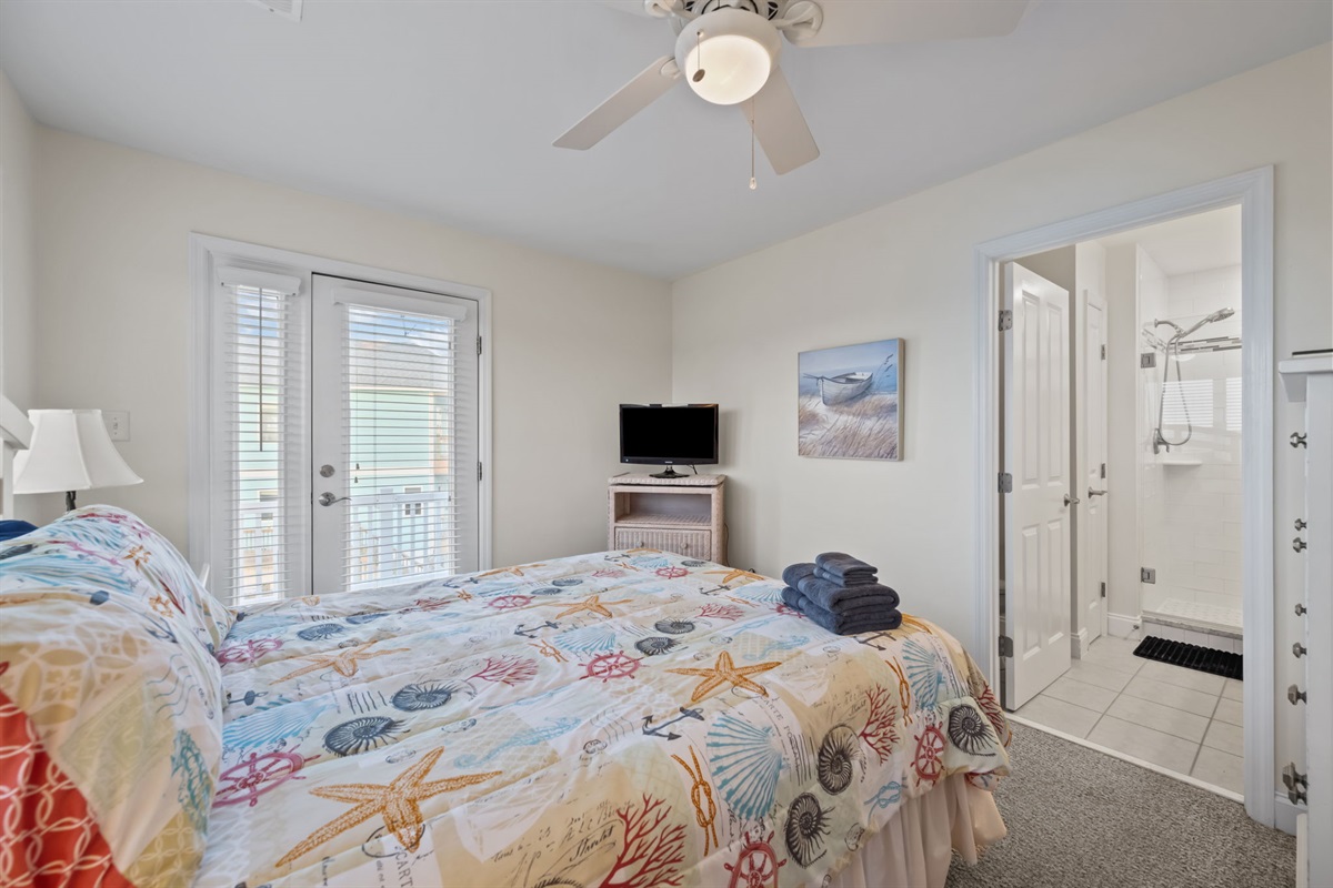 2nd floor bedroom with balcony access and en-suite bathroom