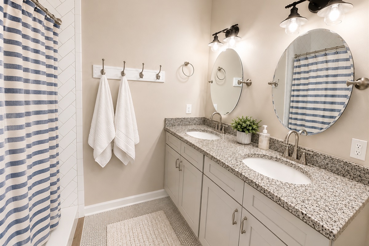 Primary en-suite shower with double sinks