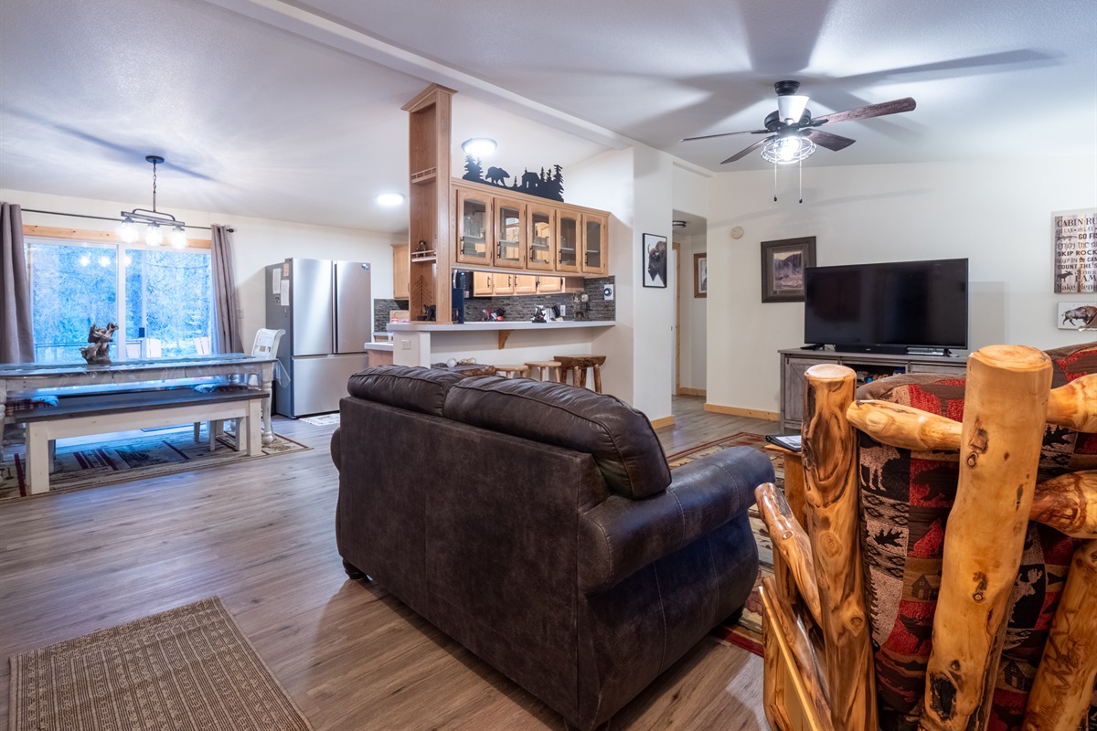 Open concept to living and kitchen along with patio doors to back deck