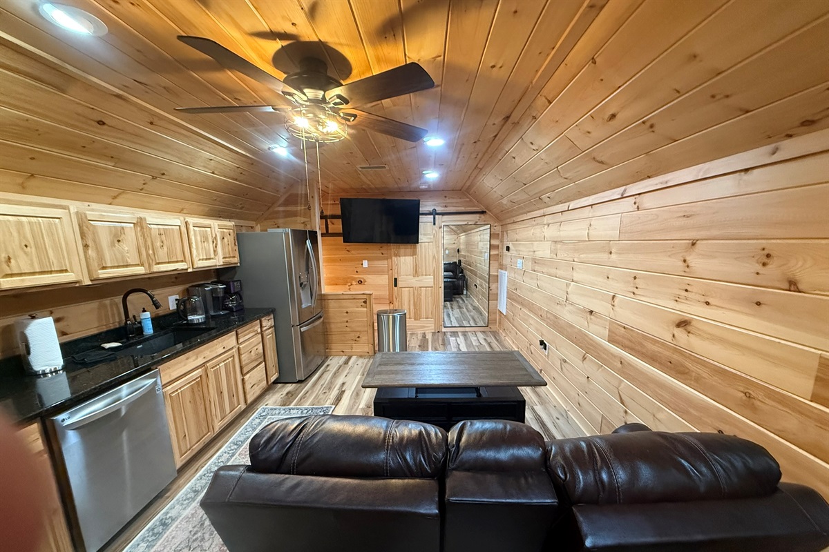 Kitchen in small cabin over garge Coffe table extends up so can sit at sofas and eat on it. 