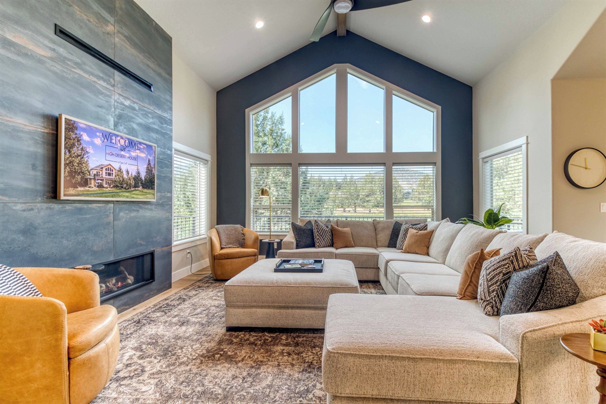 Our cozy living room features a flat screen tv, gas fireplace & plush furniture.