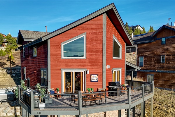 A striking red retreat nestled among the peaks—where upscale comfort meets rugged natural beauty.