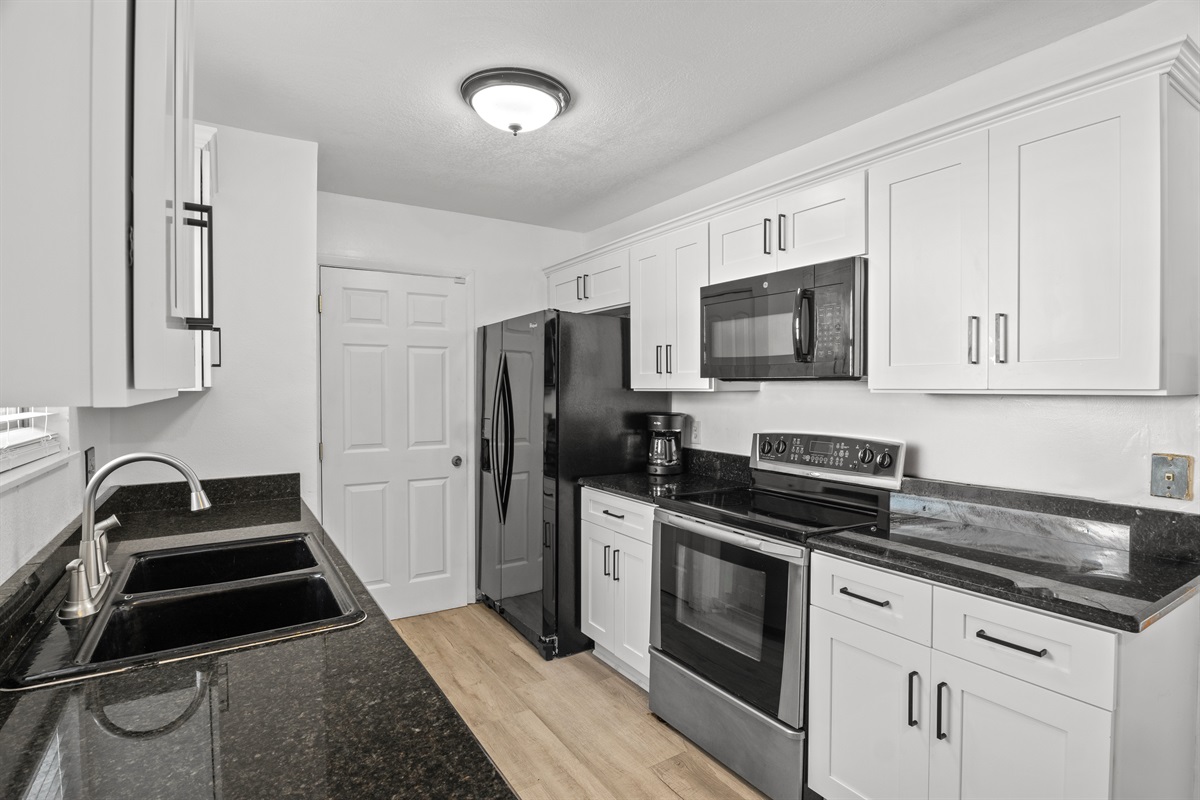 Kitchen. Refrigerator, stove, range, & microwave,