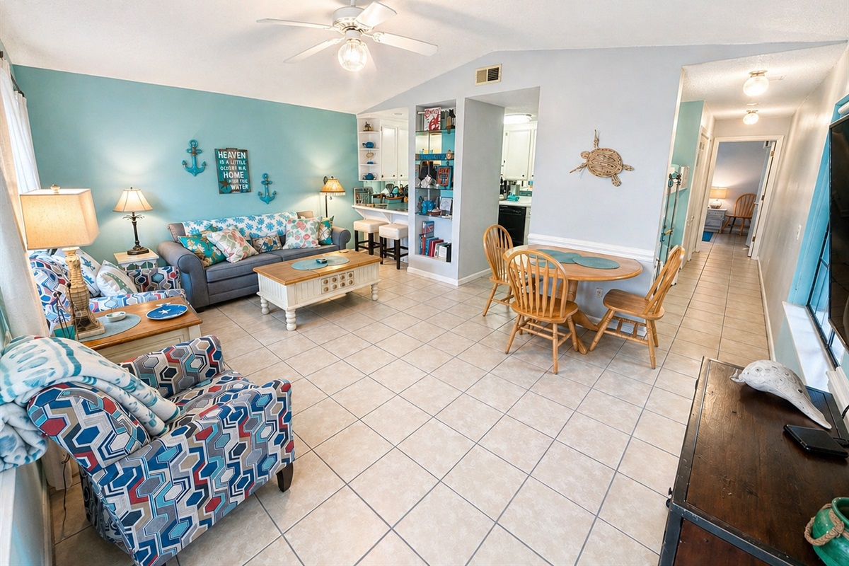 Open concept living area with vaulted ceilings