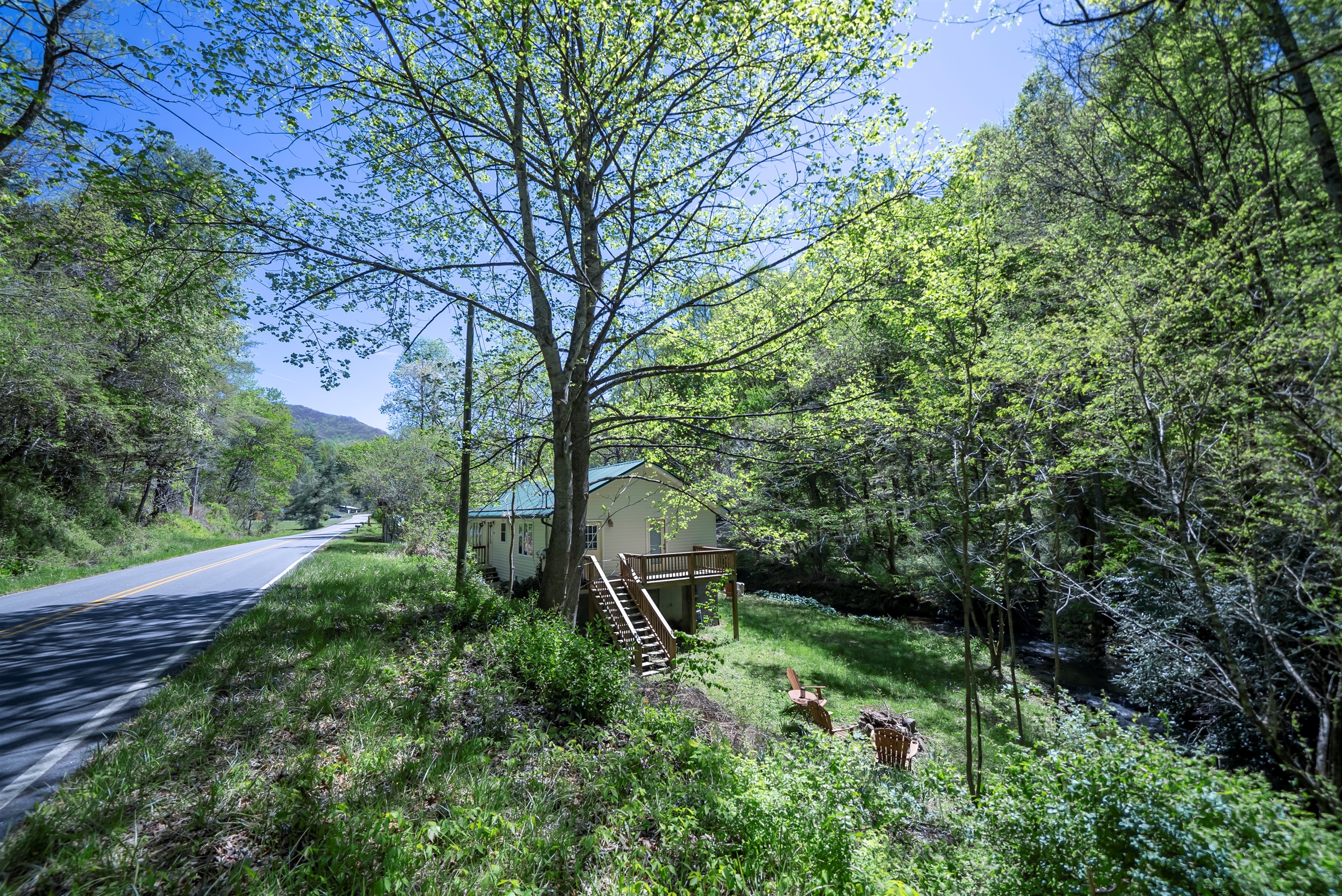 Tucked into a peaceful setting, Mossy Rocks Retreat welcomes you from the road.