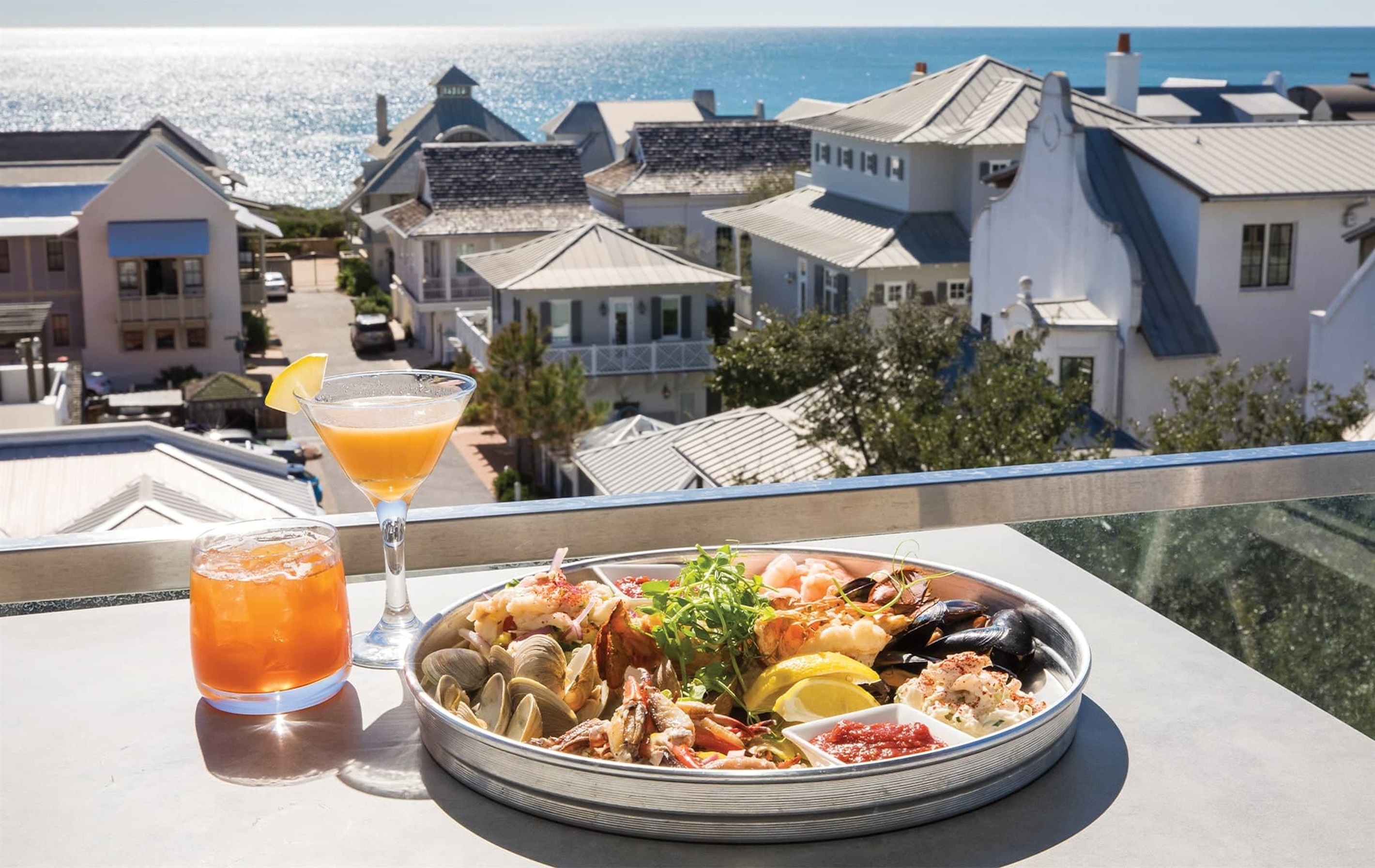 Pescado Rooftop known for elevated coastal cuisine, craft cocktails, and one of the best sunset views on 30A. Don’t miss their ‘Happy Hour’ starting at 4:30—perfect timing for golden hour glow. No reservations taken, head straight to hostess stand.