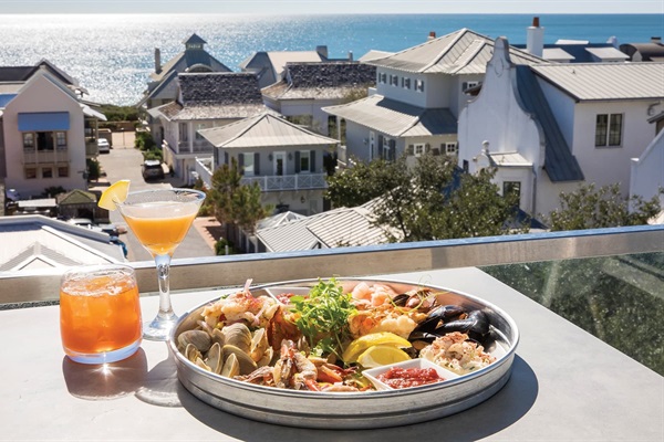 Pescado Rooftop known for elevated coastal cuisine, craft cocktails, and one of the best sunset views on 30A. Don’t miss their ‘Happy Hour’ starting at 4:30—perfect timing for golden hour glow. No reservations taken, head straight to hostess stand.