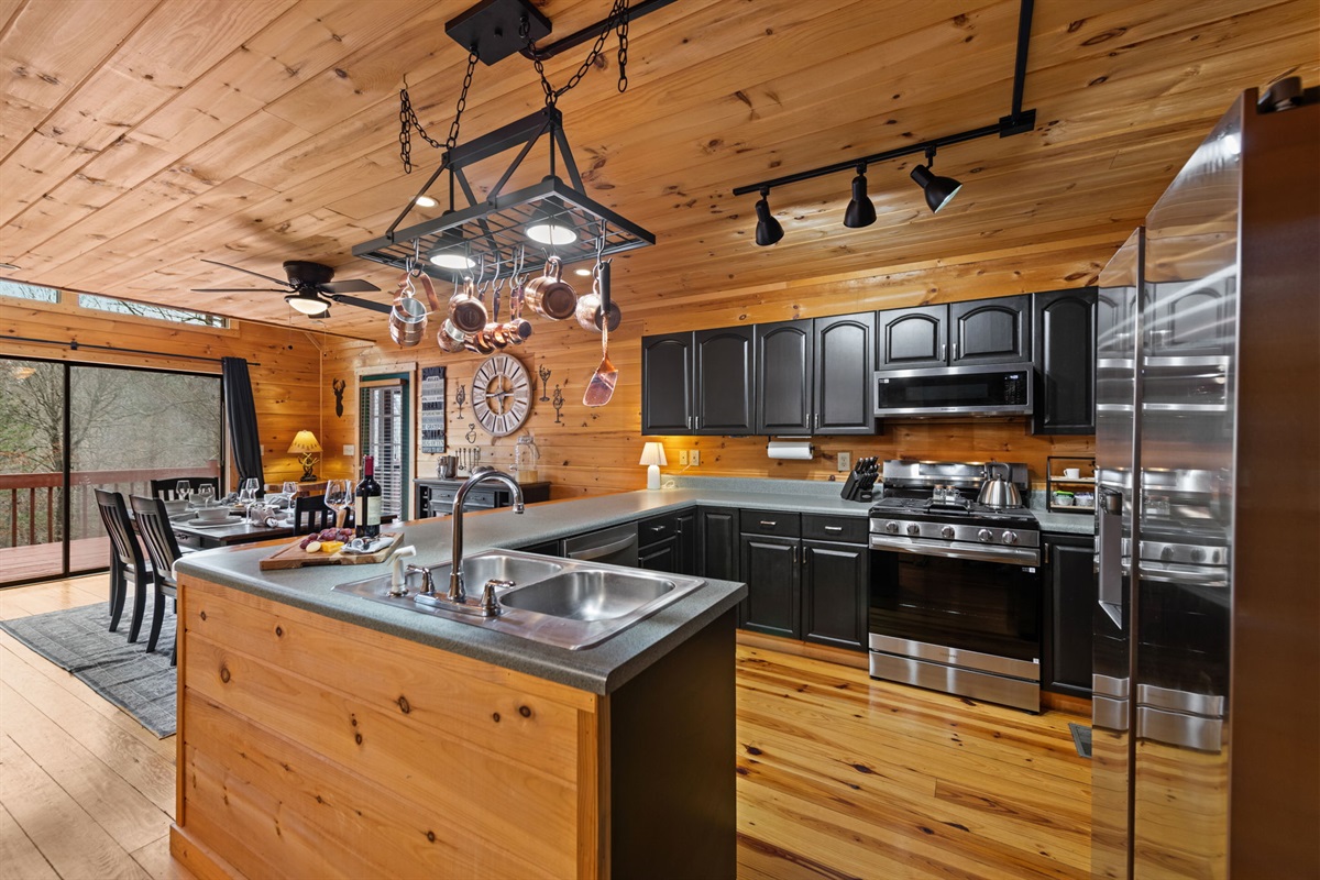 Its open layout flows seamlessly into the dining area, making it perfect for entertaining and gathering.