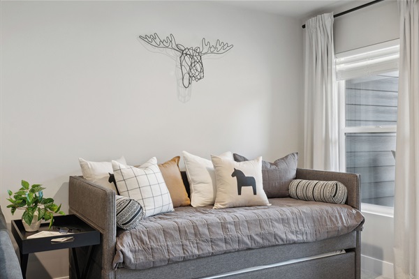 Your loft hideaway—comfortable seating by day, bonus sleeping by night.