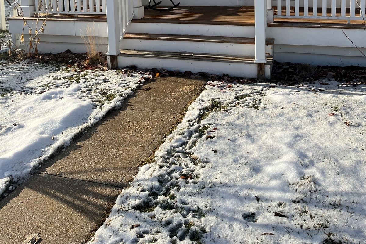 A bright red door and a rocking chair waiting just for you. Come for the charm, stay for the morning coffee with a view