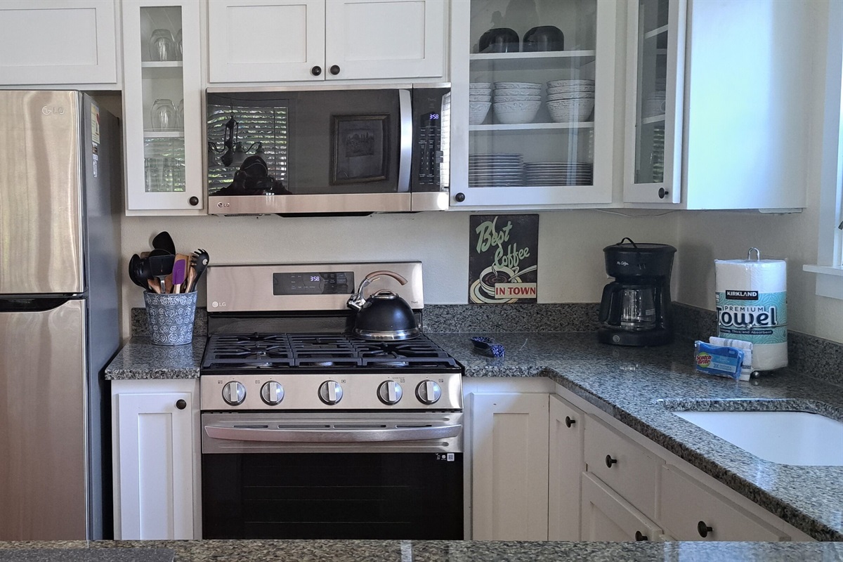 Prepare meals with ease using the modern stainless-steel appliances in the kitchen.