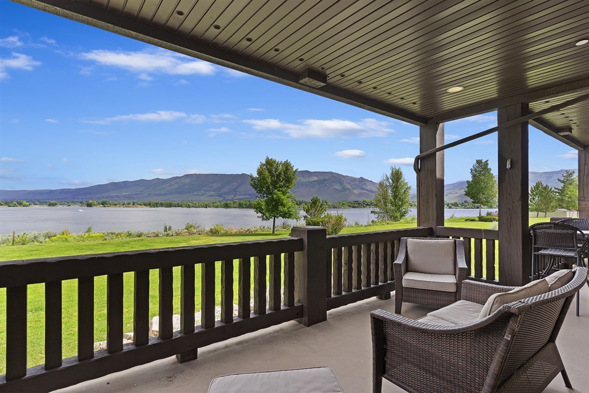 Covered balcony with seating and panoramic views of Pineview Reservoir.