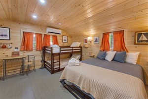 "twin bunk bed and clean white trim — perfect for a restful stay.”