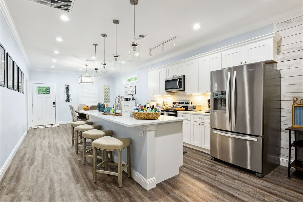 A welcoming kitchen with island seating—perfect for meals, coffee, and conversation.