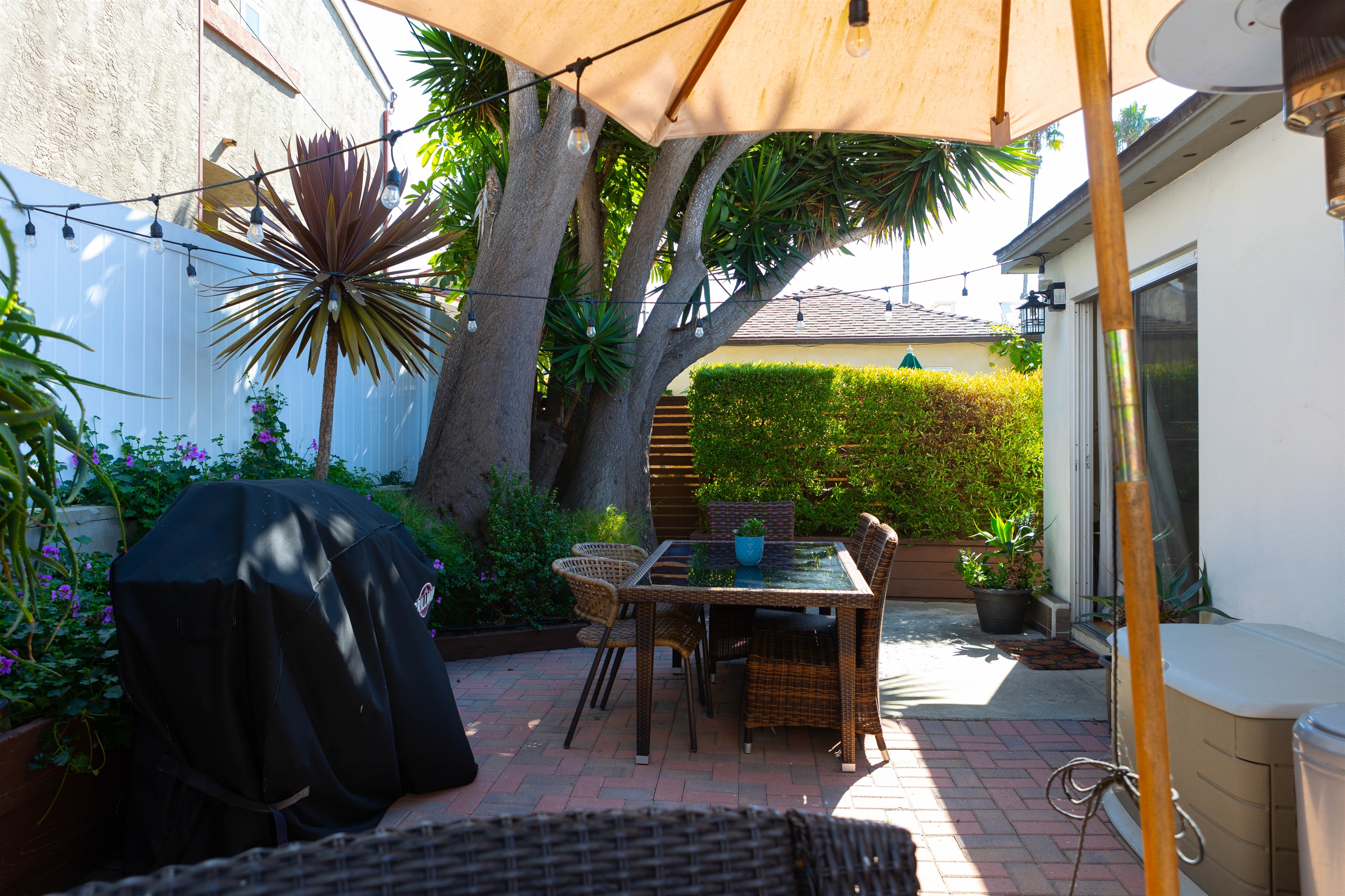 Private Back Patio with Propane BBQ Grill, Dining Area and Sitting Area